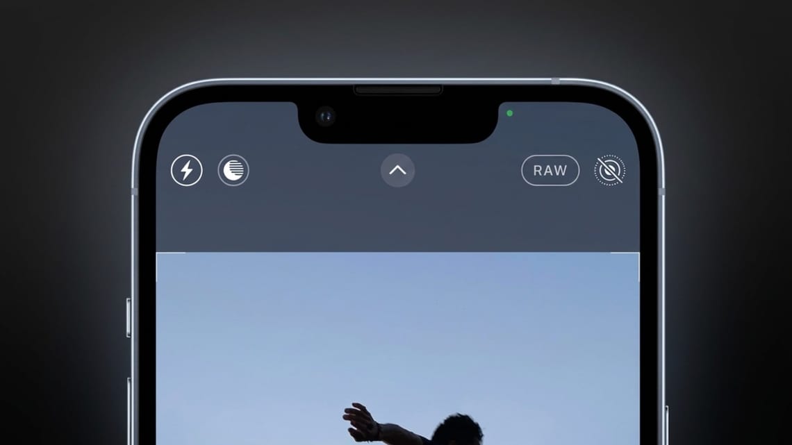 Un point vert s'affiche en haut de l'écran d'un smartphone