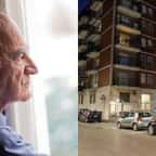 Un vieil homme regarde par la fenêtre d'une immeuble