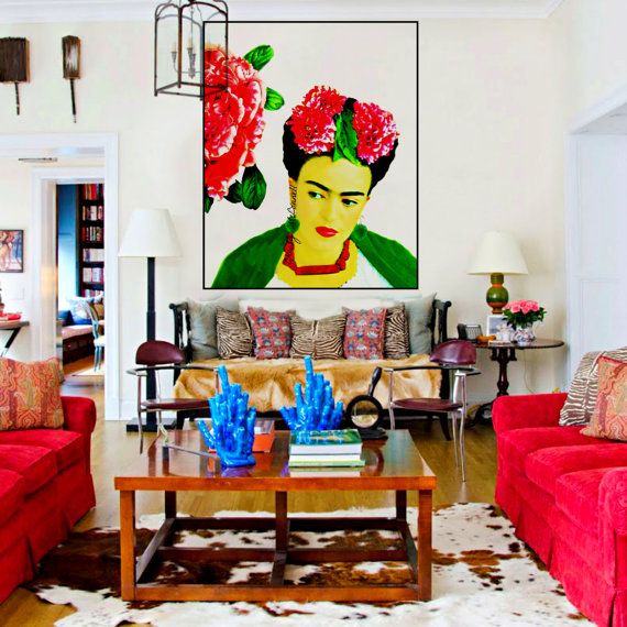 Frida Kahlo - her style was colourful, eclectic, bohemian, vibrant, and adorned with her many paintings of herself. Let's honor this brilliant artist and take a look at some of her work, a few Frida Kahlo inspired interiors, and how you can add her flair into your home! #globalhomedecor #bohemianinteriors #fridaykahlo