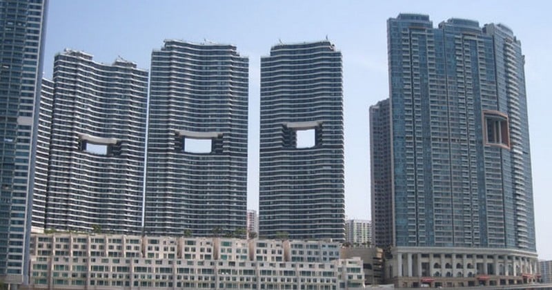 À Hong Kong, certaines grandes compagnies dépensent des fortunes pour créer des immeubles « troués »... Et voici la raison !
