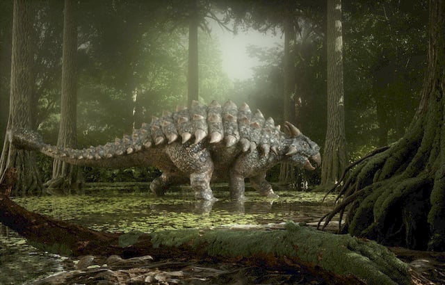 Reconstitution d'un dinosaure ankylosaure marchant dans la forêt 