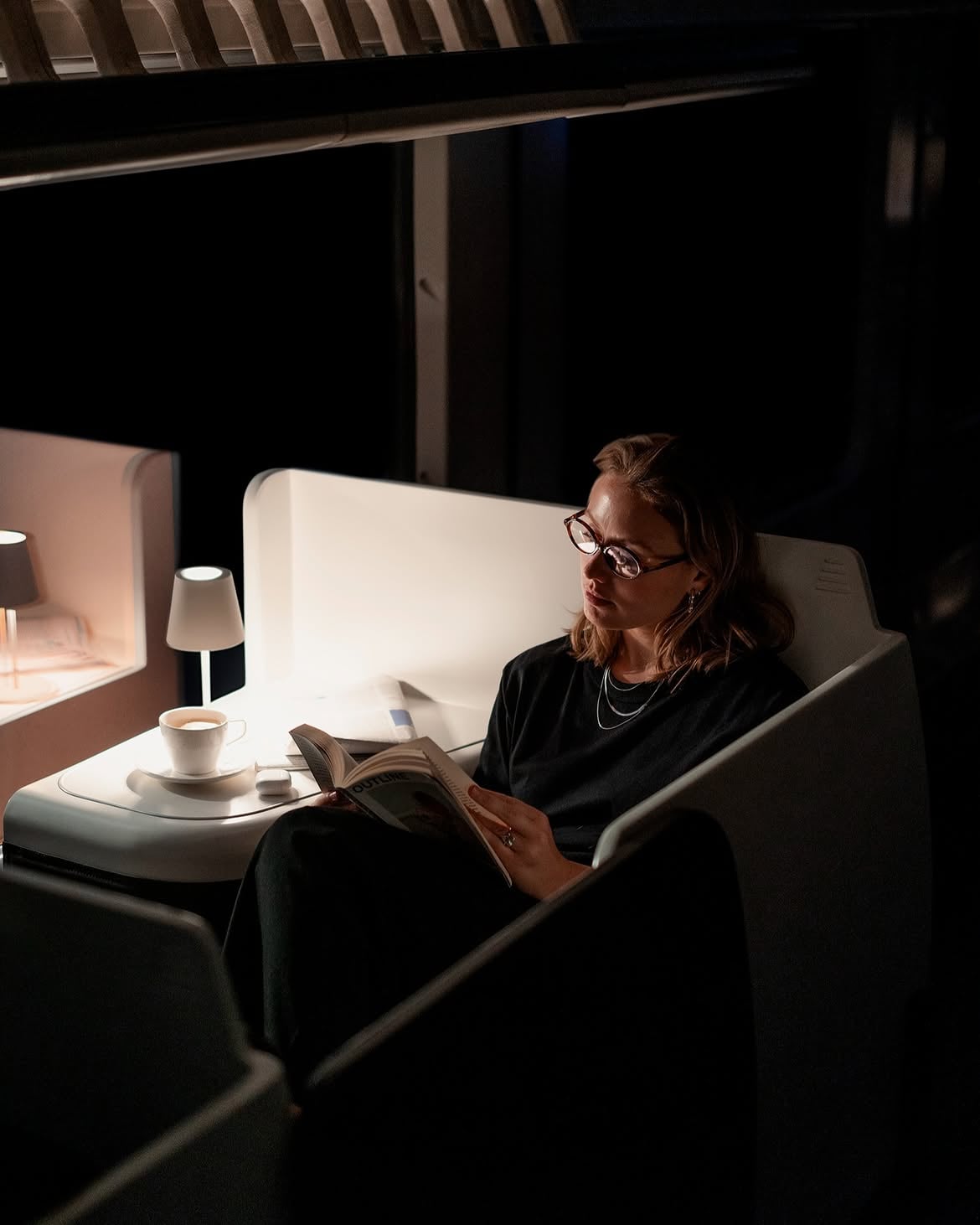 Une femme dans une cabine Nox Suite